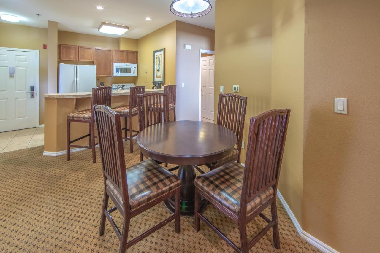 Small dining area with two chairs and a round table.